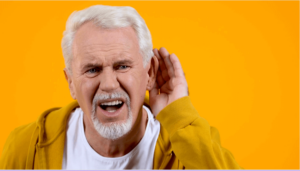 older male struggling to hear